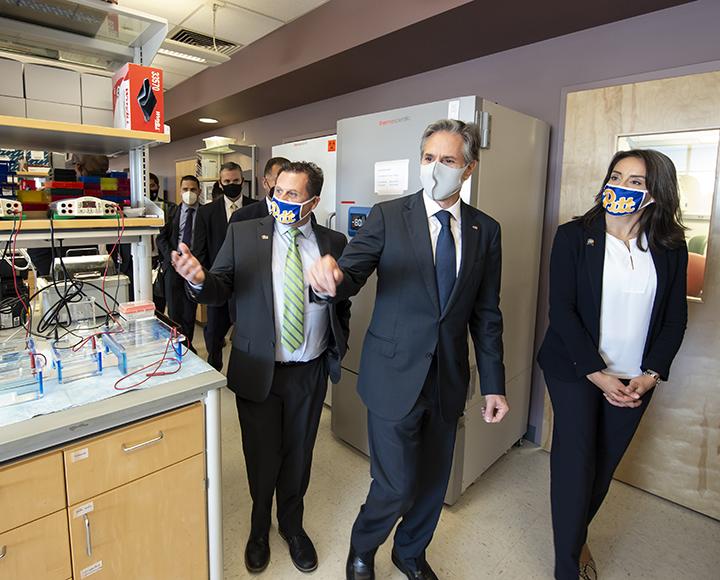 Antony Blinken walking through lab with Paul Duprex
